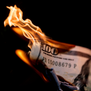 a 100 dollar bill that's burning
