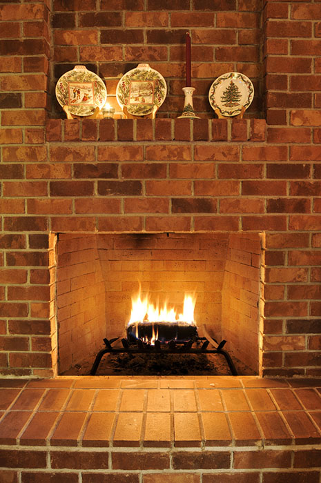 lit brick fireplace